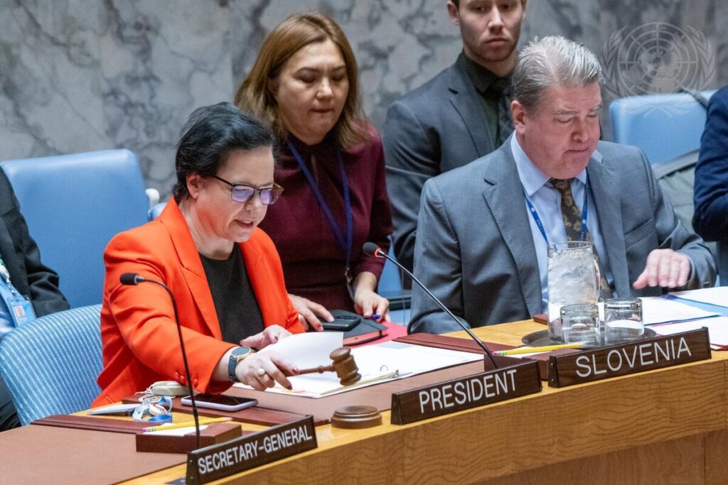 Ms. Ondina Blokar Drobič sitting at a table and delivering Slovenian statement, surrounded by other people.